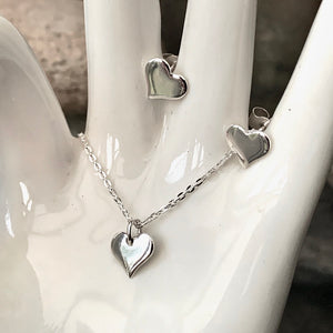 Dainty Silver heart stud earrings.