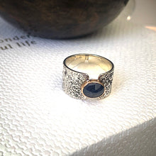 Load image into Gallery viewer, Solid sterling silver and gold ring set with deep blue, rose cut Sapphire. Size R1/2
