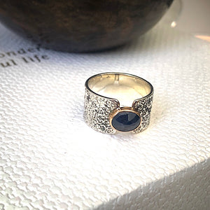 Solid sterling silver and gold ring set with deep blue, rose cut Sapphire. Size R1/2